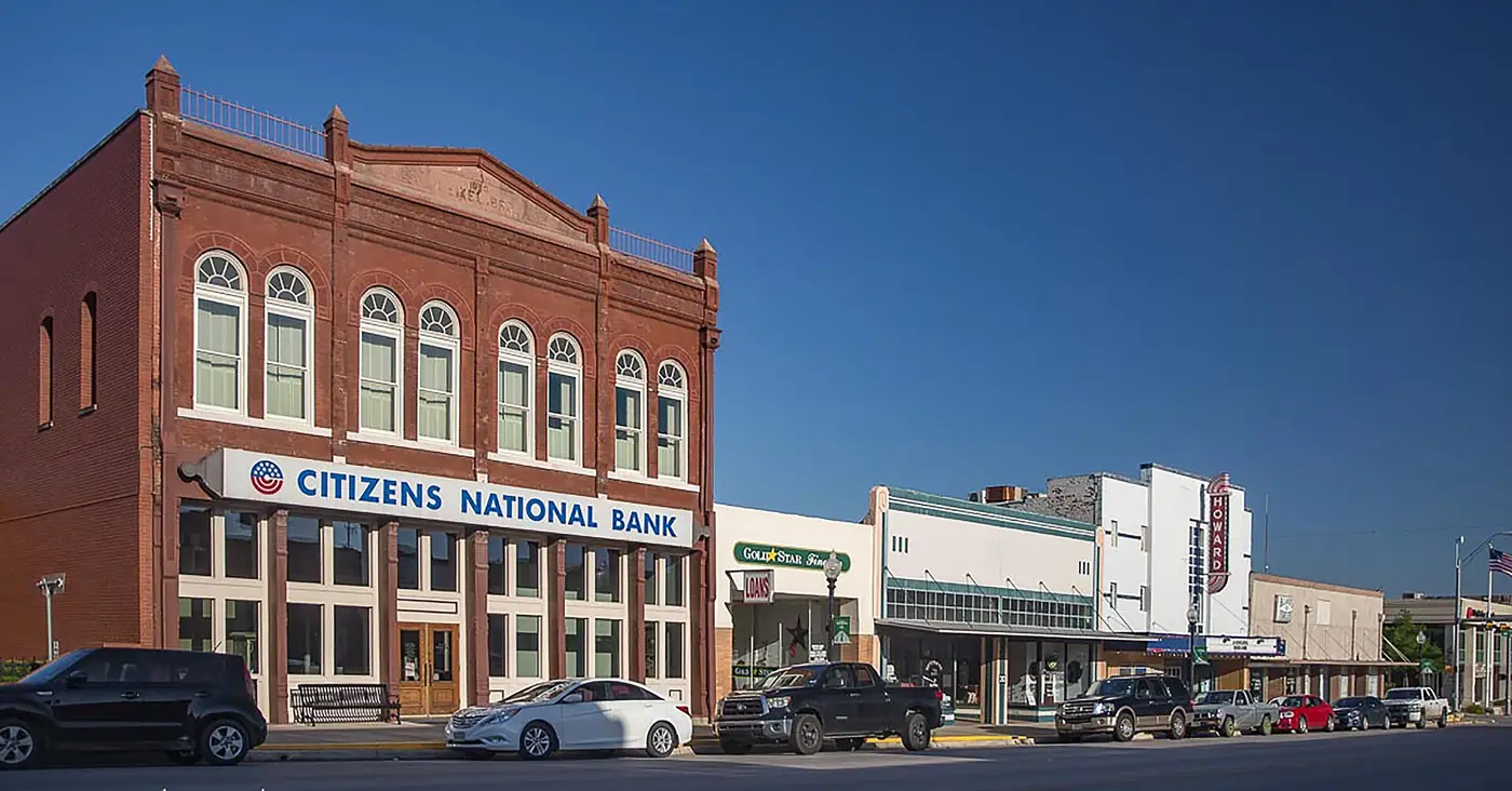 Downtown Taylor, Texas: brick storefronts on Main Street under a clear sky